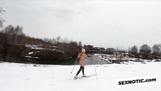 Naked girl skiing in the countryside