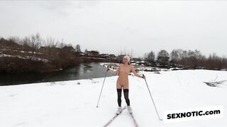 Naked girl skiing in the countryside