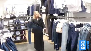 Big-Titted Blonde Fingers Herself in a Public Changing Room